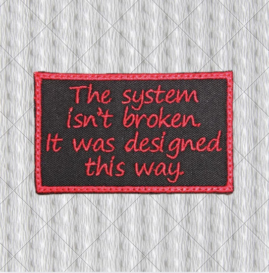 The System Isn't Broken Patch – Red Embroidery on Black Twill – Political Protest Patch