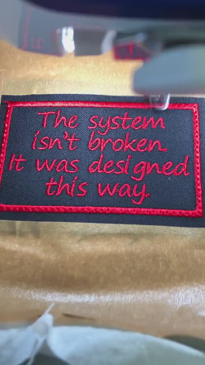 The System Isn't Broken Patch – Red Embroidery on Black Twill – Political Protest Patch